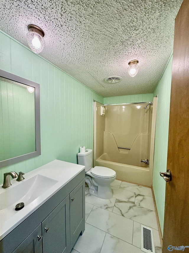 bathroom featuring  shower combination, marble finish floor, visible vents, and vanity