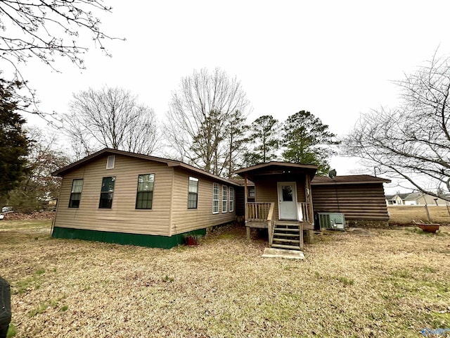 back of house featuring cooling unit