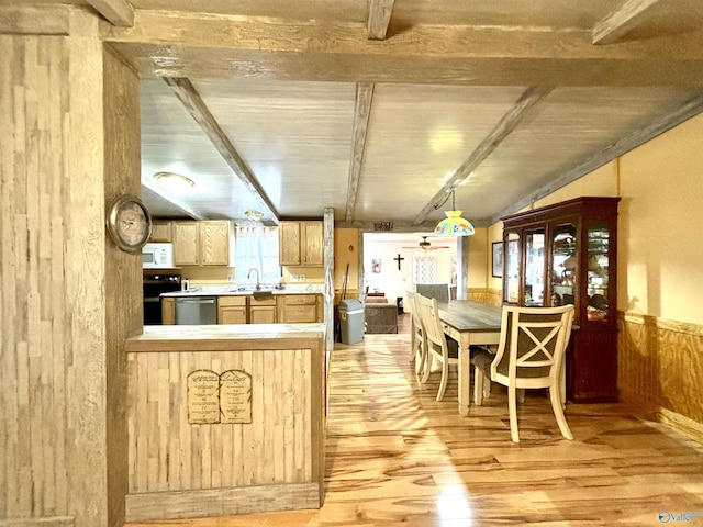 kitchen featuring electric range, stainless steel dishwasher, white microwave, light wood-style floors, and a sink