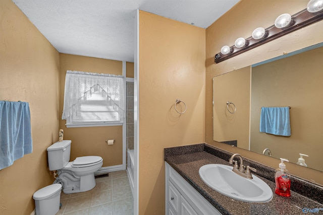 full bathroom featuring a textured ceiling, vanity, toilet, and tub / shower combination