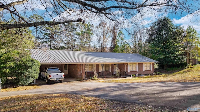 ranch-style house with a carport