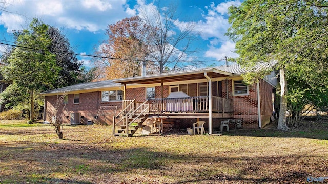 back of house with central AC unit