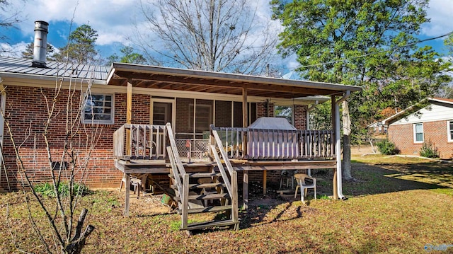 back of house featuring a lawn