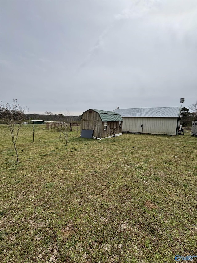 view of yard with an outbuilding and a barn