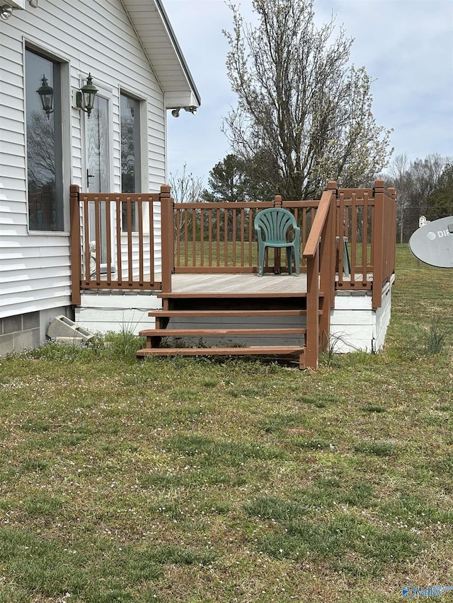 deck featuring a lawn