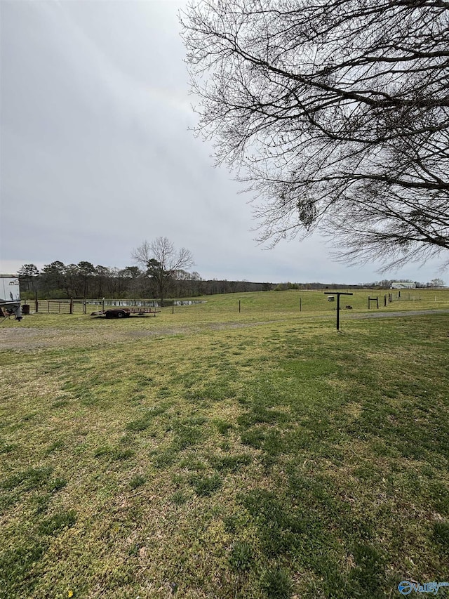 view of yard with a rural view