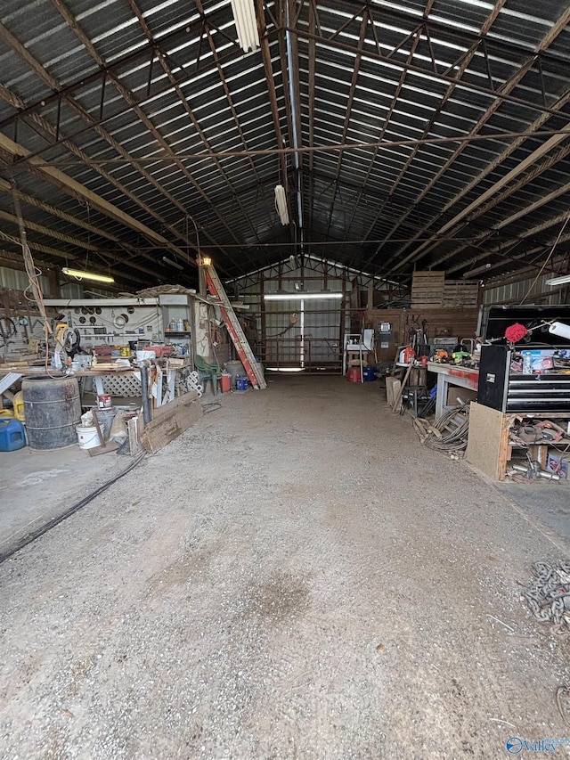 garage with metal wall and a workshop area