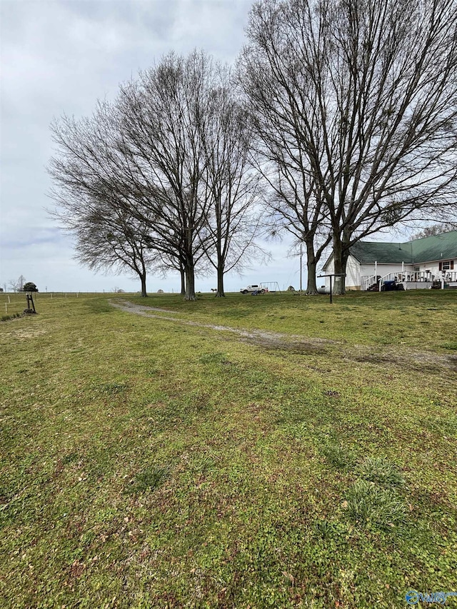 view of yard with a rural view