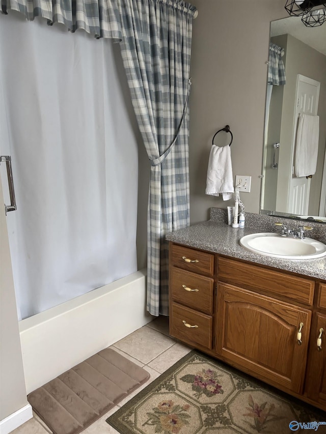 full bath featuring shower / bath combination with curtain, tile patterned flooring, and vanity