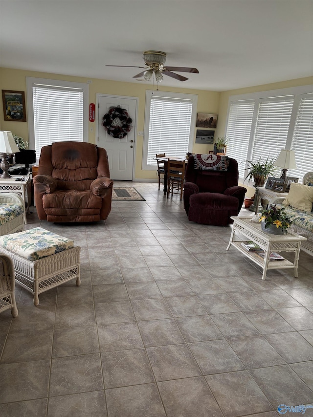 living area featuring a wealth of natural light and ceiling fan