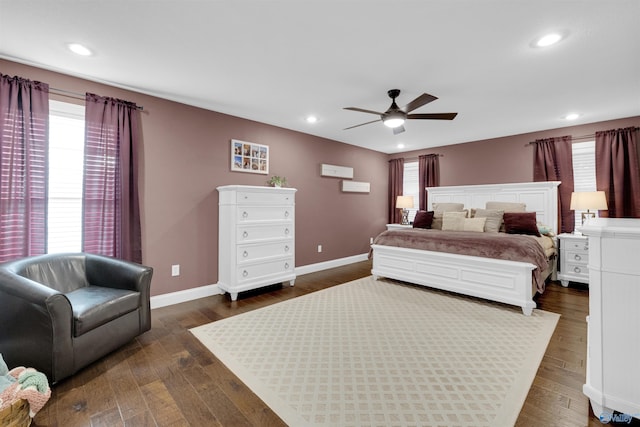 bedroom featuring ceiling fan and dark hardwood / wood-style floors