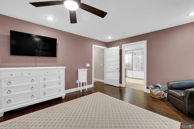 bedroom with dark hardwood / wood-style flooring and ceiling fan