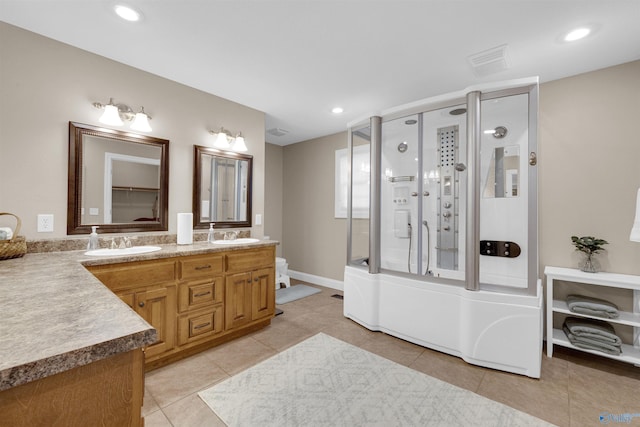 bathroom featuring vanity, an enclosed shower, and tile patterned flooring