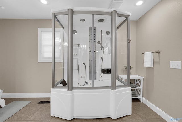 bathroom featuring walk in shower and tile patterned floors