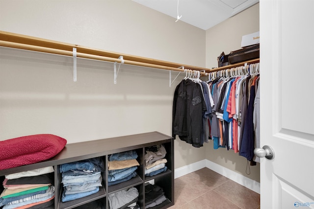 walk in closet featuring tile patterned floors