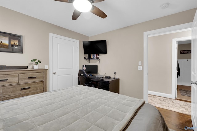 bedroom featuring wood-type flooring and ceiling fan