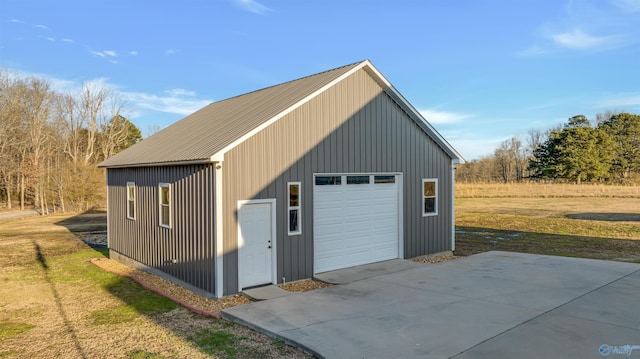 garage featuring a lawn