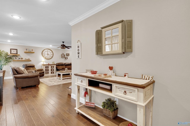 interior space featuring hardwood / wood-style flooring and ornamental molding