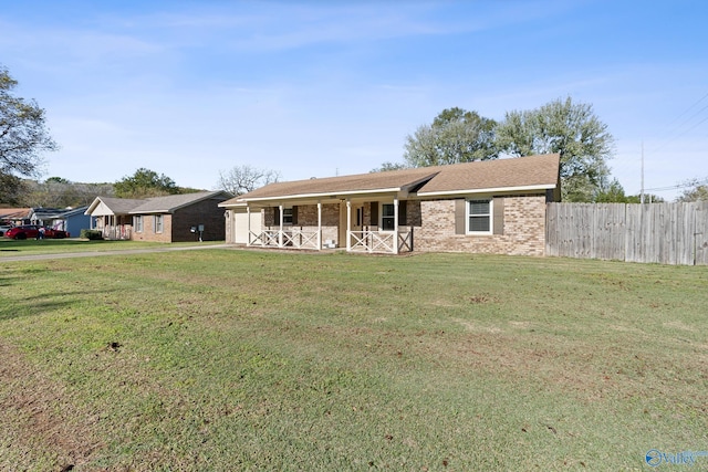 single story home featuring a front lawn