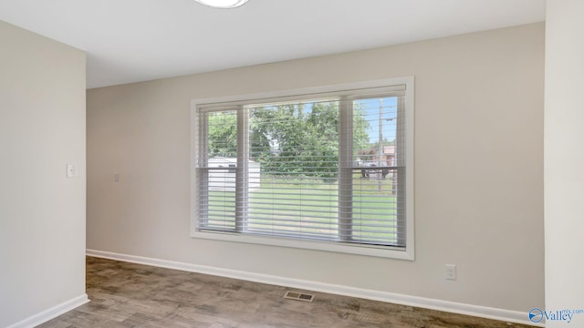 4212 Mcclain Ln NW, Huntsville, AL 35810 - empty room with baseboards and wood finished floors