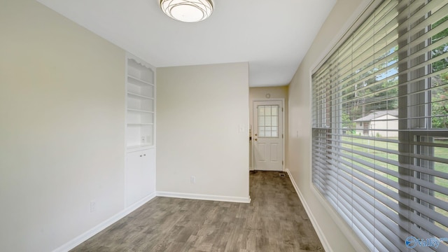 4212 Mcclain Ln NW, Huntsville, AL 35810 - empty room with wood finished floors and baseboards