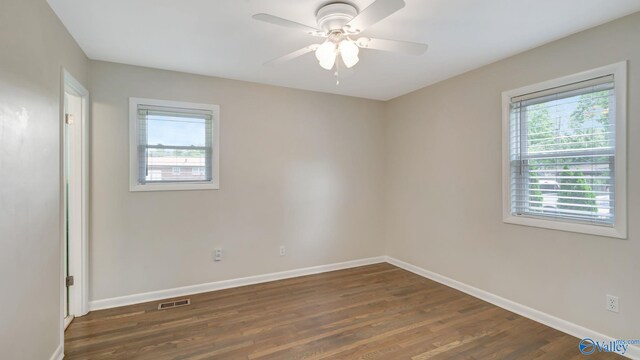 4212 Mcclain Ln NW, Huntsville, AL 35810 - unfurnished room with dark wood finished floors, baseboards, and a ceiling fan