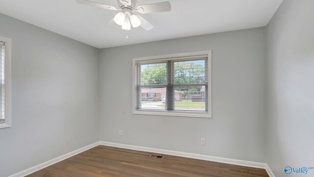 4212 Mcclain Ln NW, Huntsville, AL 35810 - empty room with baseboards, dark wood-style floors, and ceiling fan