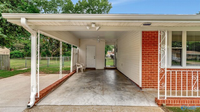 4212 Mcclain Ln NW, Huntsville, AL 35810 - view of patio / terrace with a carport, driveway, and a gate