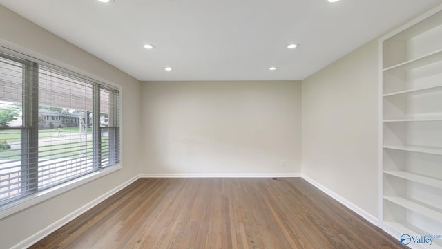 4212 Mcclain Ln NW, Huntsville, AL 35810 - spare room featuring wood finished floors, baseboards, recessed lighting, and built in features