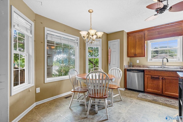 213 Hollington Dr, Huntsville, AL 35811 - dining room with a chandelier, a textured ceiling, and a ceiling fan