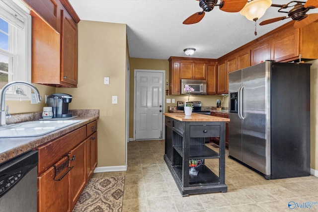 213 Hollington Dr, Huntsville, AL 35811 - kitchen featuring stainless steel appliances, a ceiling fan, butcher block countertops, open shelves, and brown cabinetry