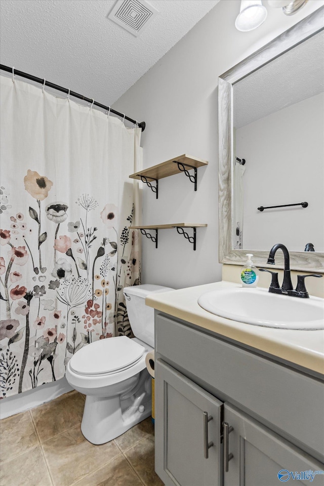 213 Hollington Dr, Huntsville, AL 35811 - bathroom with vanity, a textured ceiling, tile patterned floors, and curtained shower