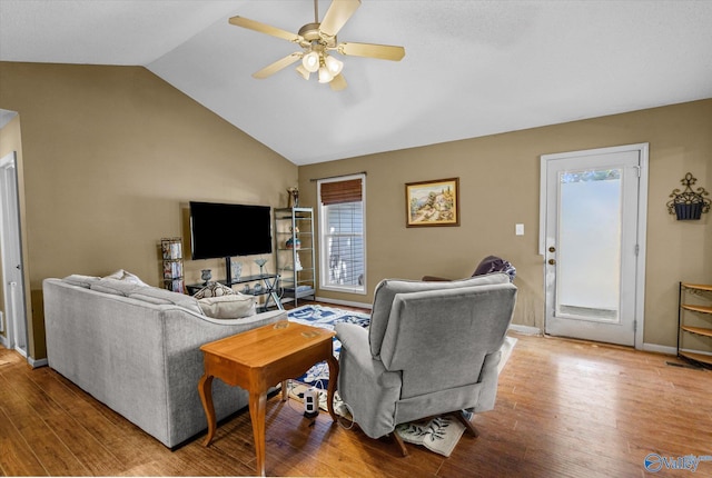 213 Hollington Dr, Huntsville, AL 35811 - living room featuring wood finished floors, a ceiling fan, and vaulted ceiling