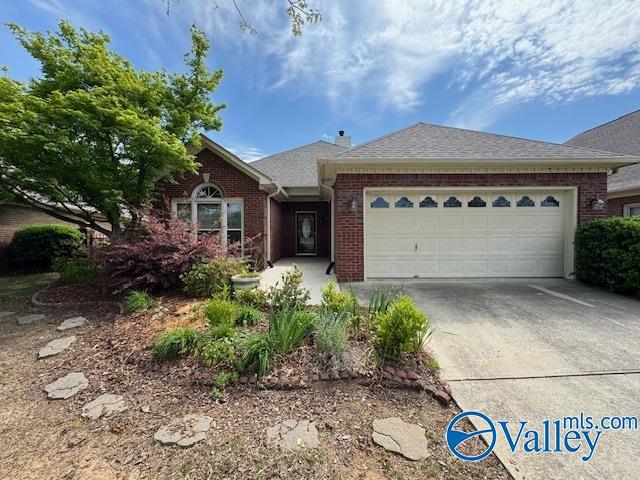 15031 Ashmont Blvd SE, Huntsville, AL 35803 - ranch-style house featuring brick siding, an attached garage, roof with shingles, and driveway