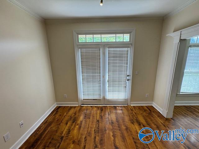 15031 Ashmont Blvd SE, Huntsville, AL 35803 - unfurnished room featuring wood finished floors, baseboards, and a healthy amount of sunlight