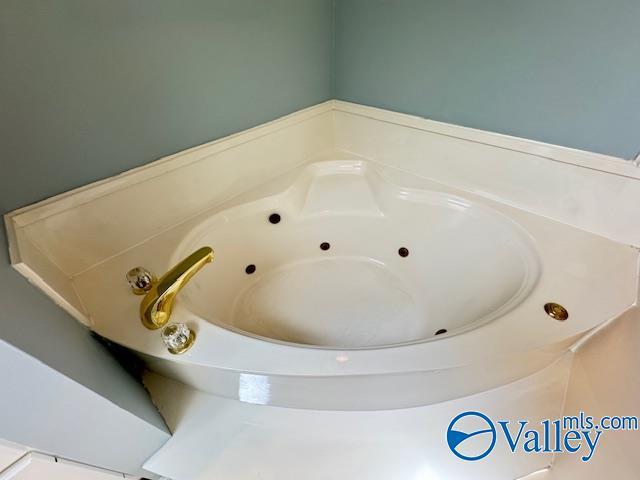 15031 Ashmont Blvd SE, Huntsville, AL 35803 - bathroom featuring a tub with jets