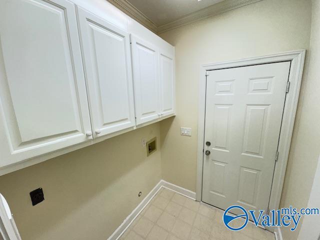 15031 Ashmont Blvd SE, Huntsville, AL 35803 - clothes washing area with ornamental molding, baseboards, cabinet space, and washer hookup