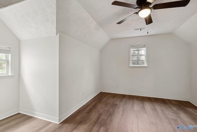 1502 Bower Dr SE, Cullman, AL 35055 - additional living space with visible vents, a textured ceiling, wood finished floors, and a wealth of natural light
