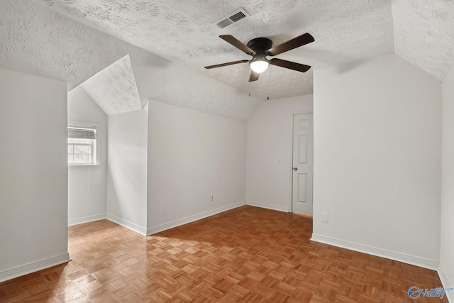 1502 Bower Dr SE, Cullman, AL 35055 - additional living space with vaulted ceiling, a ceiling fan, a textured ceiling, baseboards, and visible vents