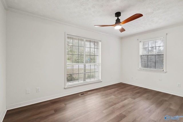 1502 Bower Dr SE, Cullman, AL 35055 - spare room featuring a wealth of natural light, dark wood-type flooring, and a ceiling fan