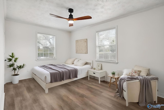 1502 Bower Dr SE, Cullman, AL 35055 - bedroom with ornamental molding, a textured ceiling, baseboards, and wood finished floors