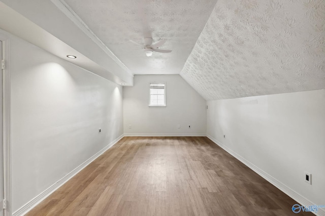 1502 Bower Dr SE, Cullman, AL 35055 - additional living space with a textured ceiling, wood finished floors, baseboards, and a ceiling fan