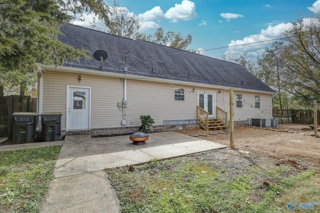1502 Bower Dr SE, Cullman, AL 35055 - back of house featuring a patio area, fence, a shingled roof, entry steps, and central AC unit