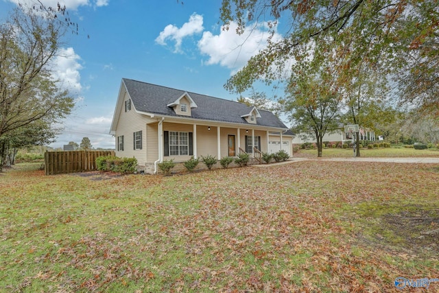 1502 Bower Dr SE, Cullman, AL 35055 - view of front of property with fence, an attached garage, driveway, a front lawn, and covered porch