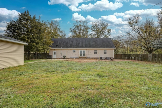 1502 Bower Dr SE, Cullman, AL 35055 - rear view of house featuring a lawn, central air condition unit, a fenced backyard, and french doors