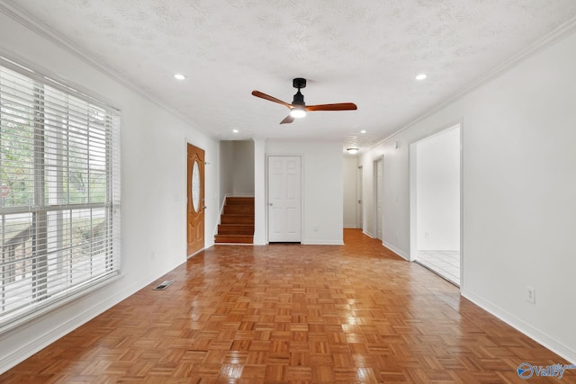 1502 Bower Dr SE, Cullman, AL 35055 - unfurnished room with stairway, ornamental molding, baseboards, a textured ceiling, and a ceiling fan