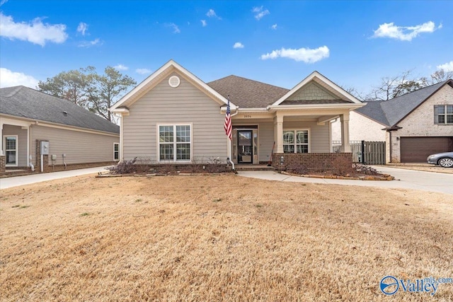 view of front of home with a front yard and brick siding