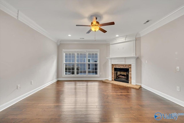 unfurnished living room featuring dark wood-style floors, visible vents, ornamental molding, and baseboards