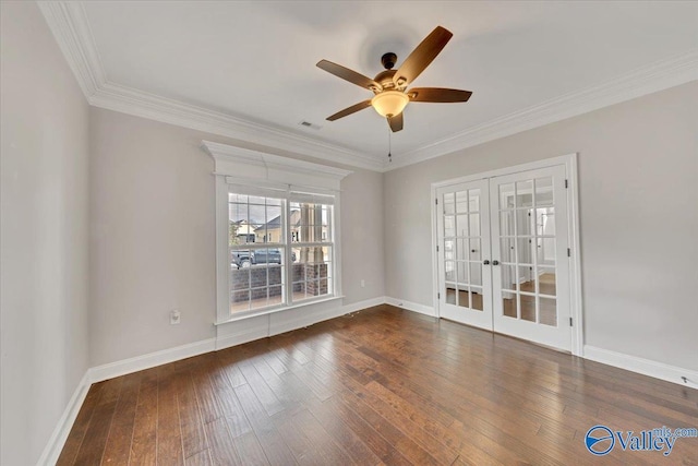 spare room with ornamental molding, french doors, dark wood finished floors, and baseboards