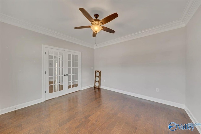 spare room with baseboards, ornamental molding, dark wood finished floors, and french doors